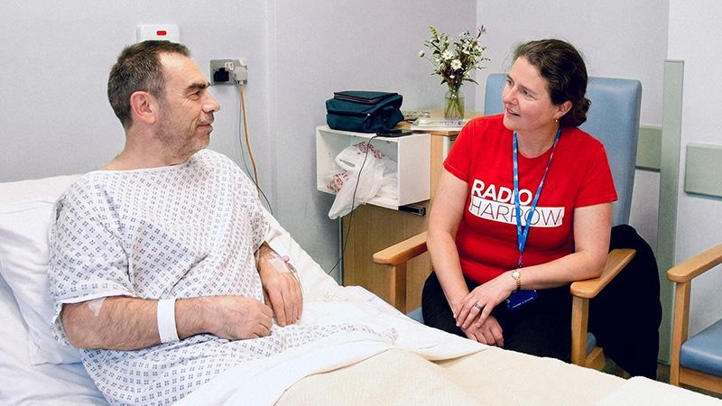 Radio Harrow volunteers visiting a patient
